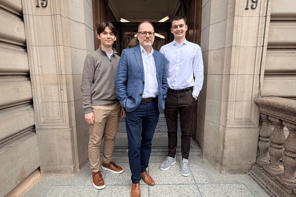 Apprentices Archie, Noah pictured with Thomas Brady